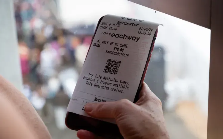 A close up of a horse betting slip from the tote.