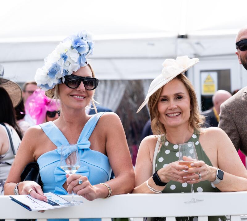 Two ladies in fascinators at Worcester Racecourse