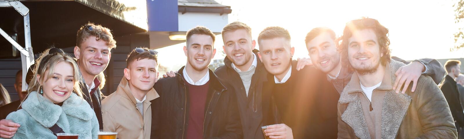 A large group of friends enjoy the races at Worcester