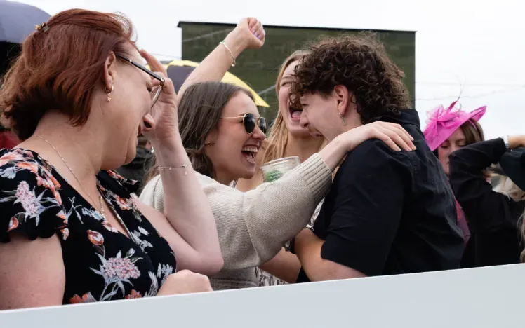 A group of friends celebrating a win at Worcester Racecourse