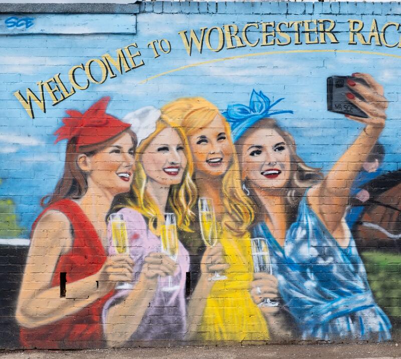 A mural of ladies dressed up for the races at Worcester Racecourse