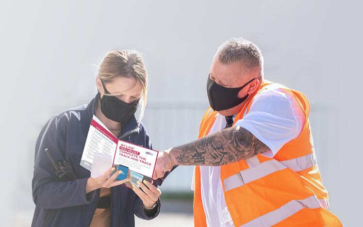 A Wolverhampton Racecourse customer is helped plan their day at the races